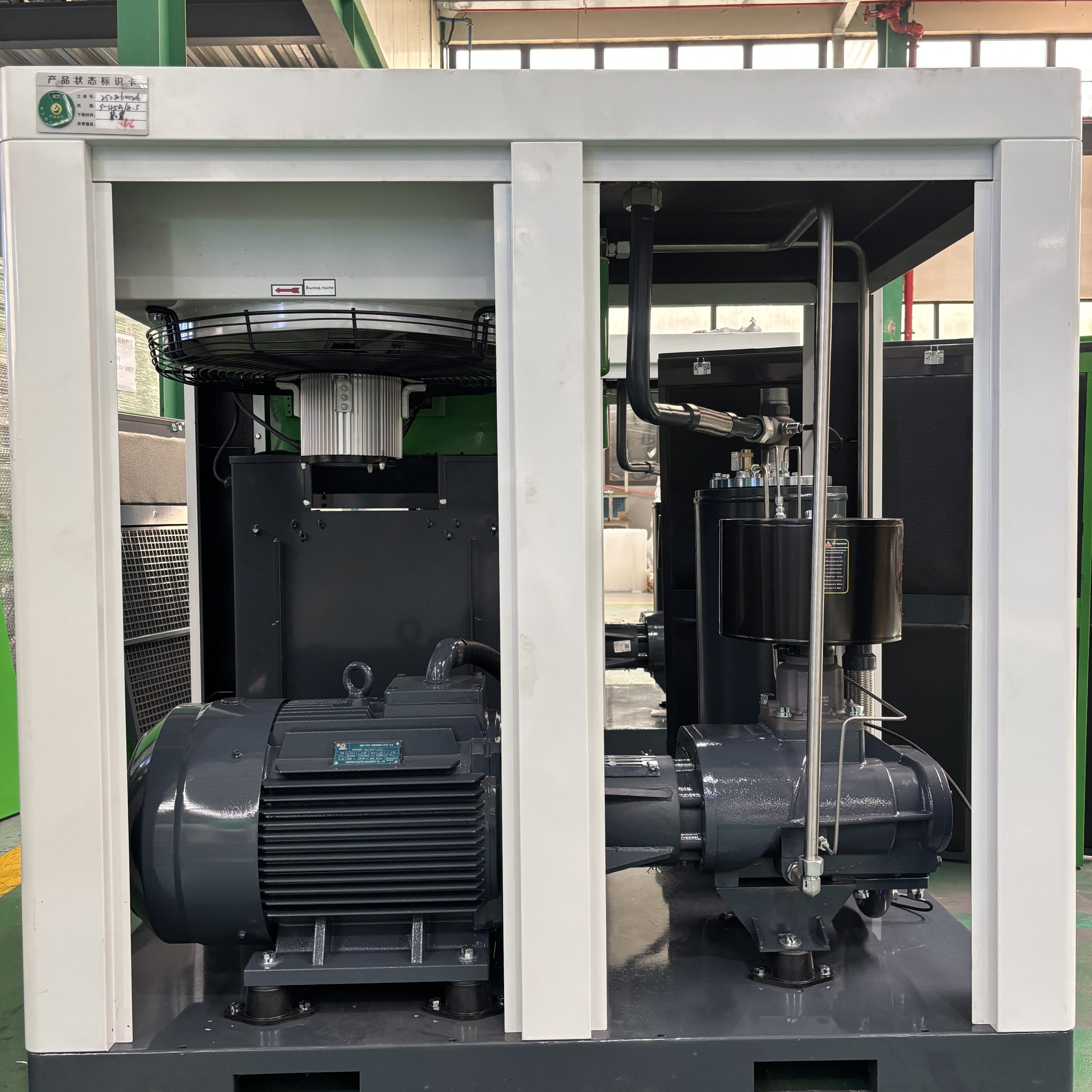 Internal view of screw compressor showing motor and steel pipelines